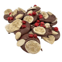 Milk chocolate mendiants with banana, almond, red currants and cacao nibs chunks 5407008470302 The Belgian Chocolate Makers